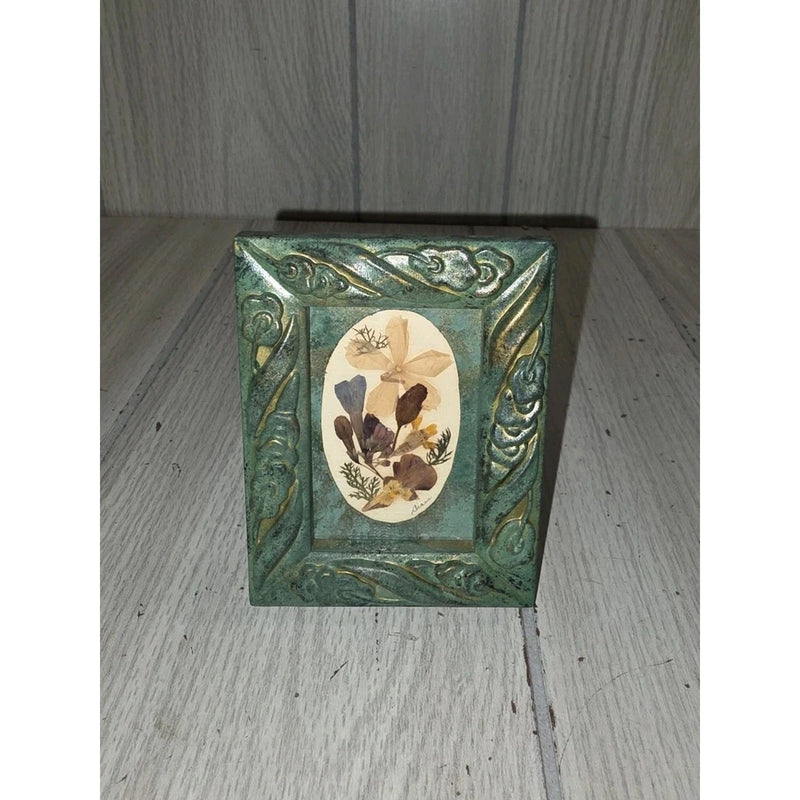 Mini framed pressed dried flower artwork with ornate green frame and oval botanical center