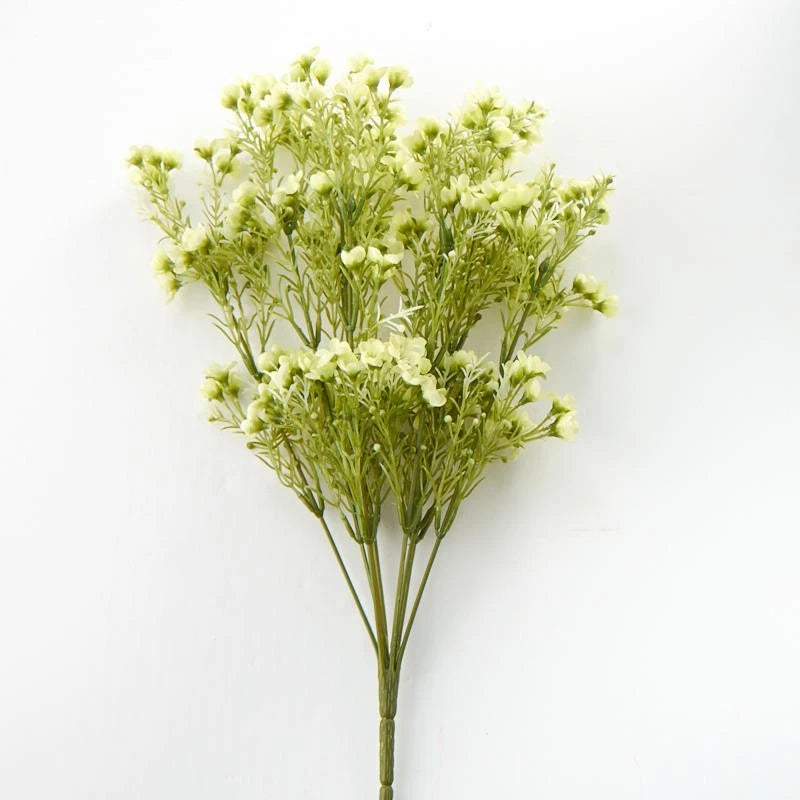 Artificial green wax flower bush with clustered pale blooms and branching stems