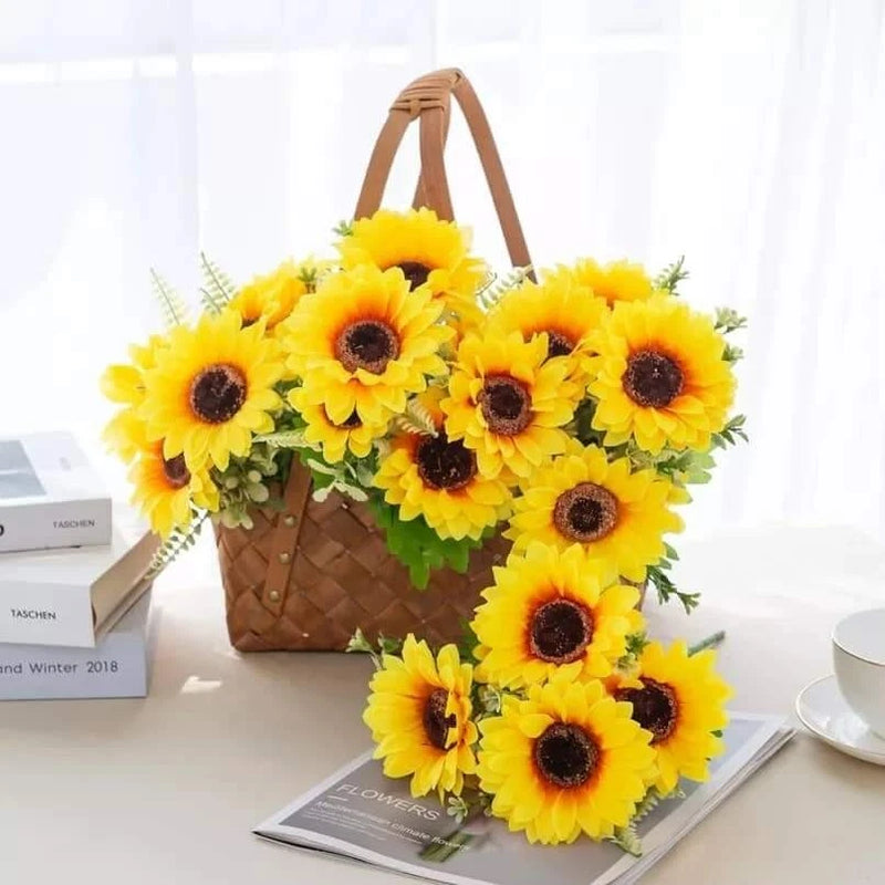 Bridal sunflower bouquet with 10 bright yellow blooms and dark centers, tied with brown handle.