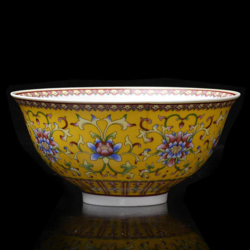 Hand-painted porcelain bowl with yellow ground, peony and floral patterns, decorative rim