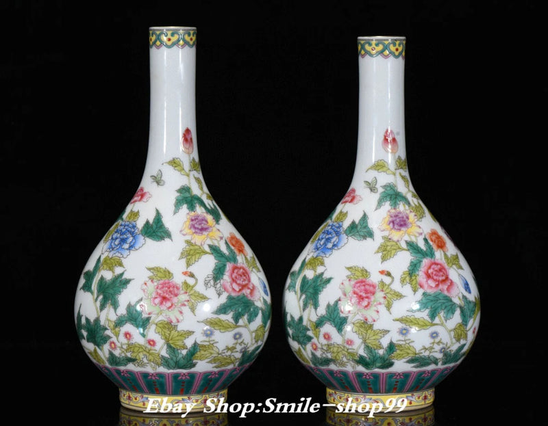 Pair of white porcelain peony floral vases with gold trim, rounded bottle shape