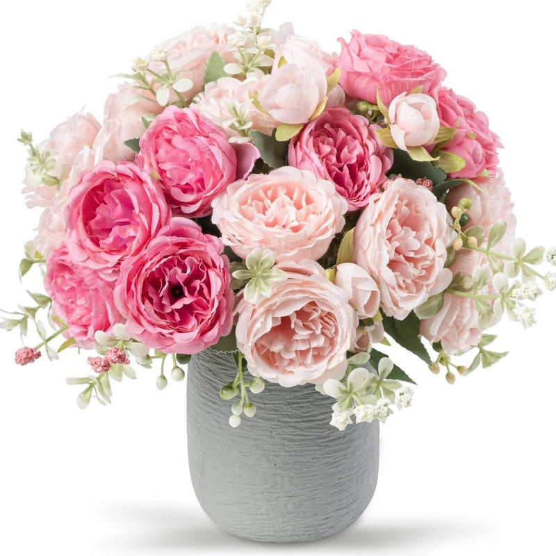 Artificial pink peony silk flower bouquet with soft white blooms in a gray vase