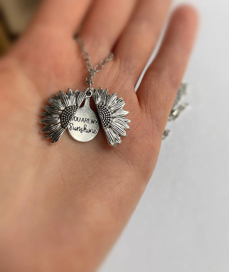 Silver sunflower pendant necklace with two engraved medallions and chain