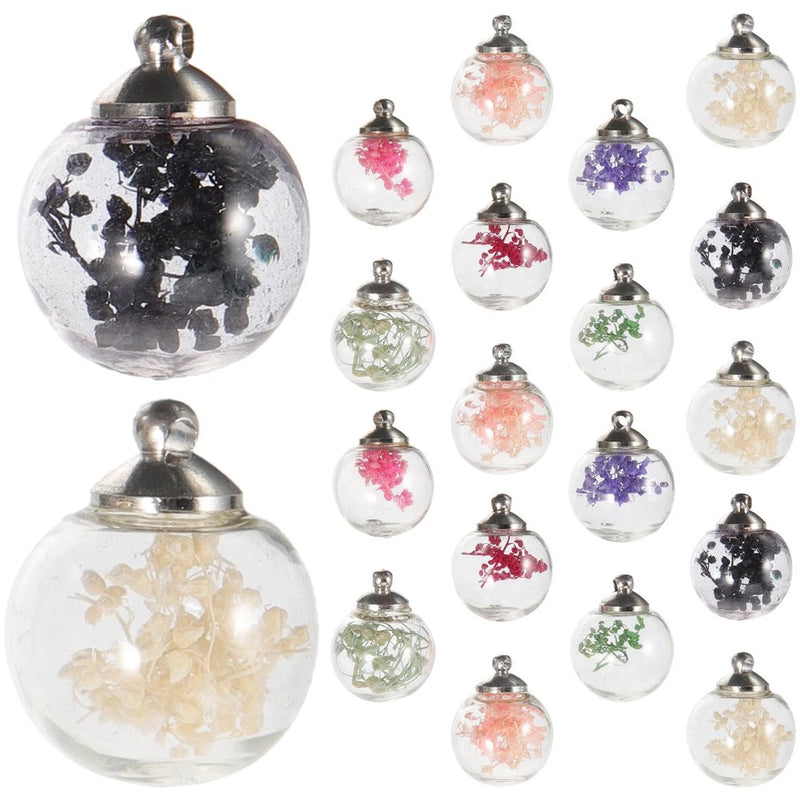 Clear glass dried-flower globe pendants with metal caps, assorted blooms inside.