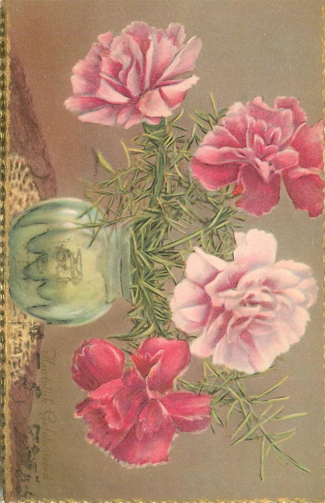 Carnation bouquet in glass vase with pink and white blooms and green stems