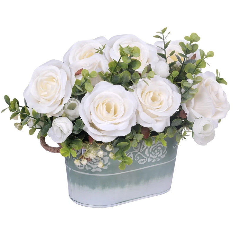 Artificial rose flower arrangement with white roses and green leaves in light blue pot
