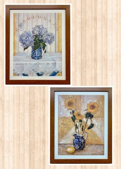 Pair of framed floral art prints with blue flowers and sunflower in vases