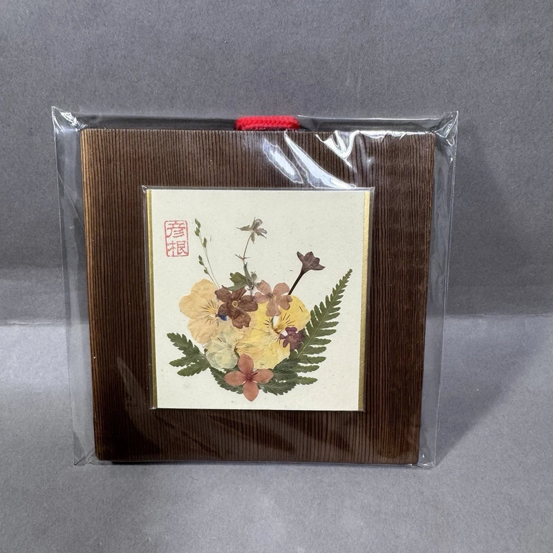 Wood-framed pressed flower Japanese print on board, floral bouquet with red seal.