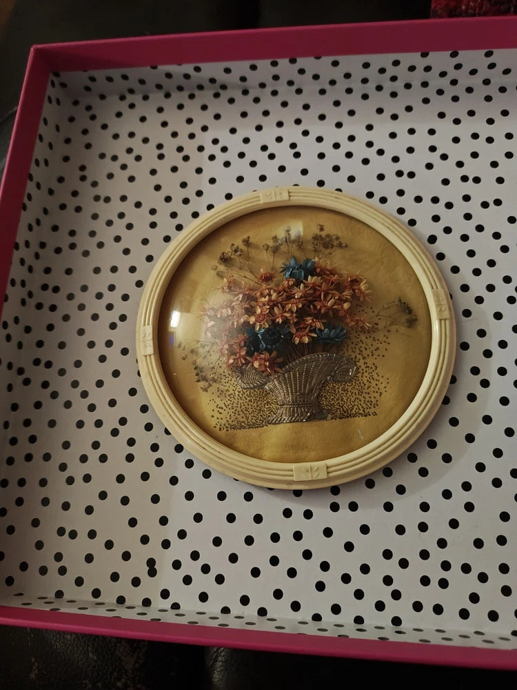 Dried flower oval dome wall hanging with framed floral bouquet under glass