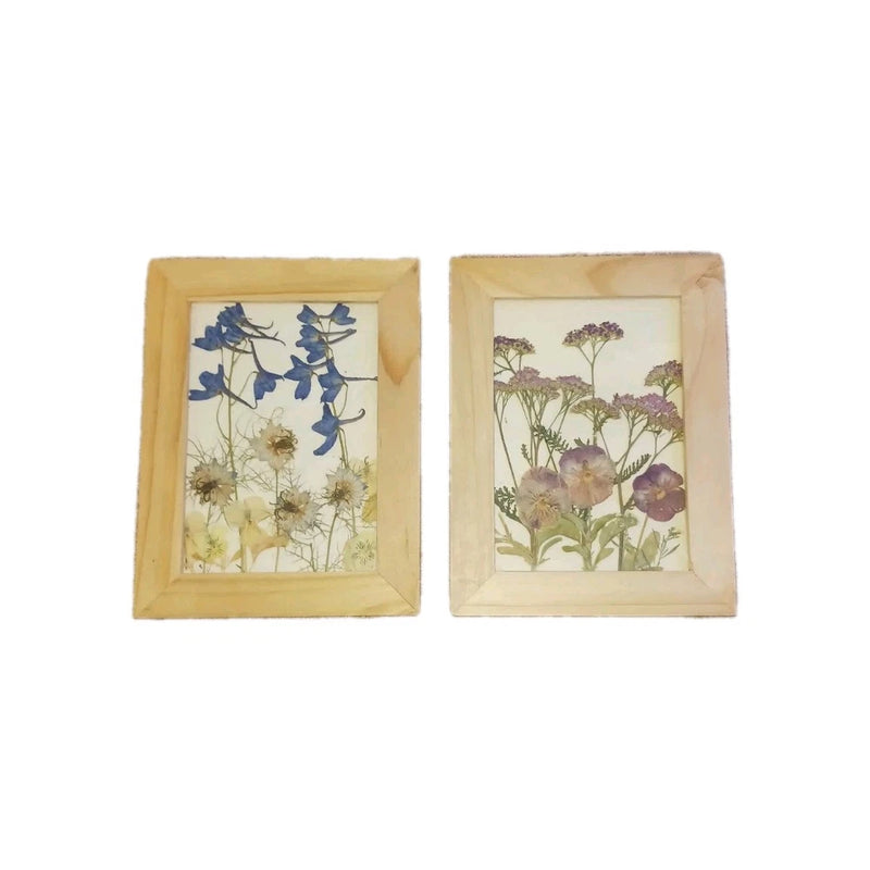 Framed pressed dried wildflower wall art with blue and purple flowers