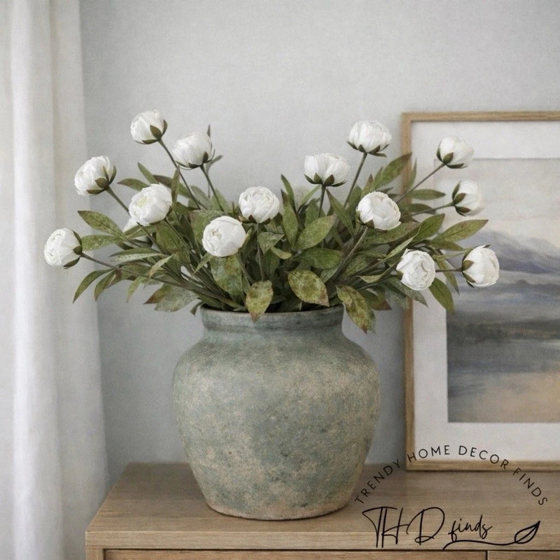 Set of 6 cream peony flower stems with buds and green leaves in a gray vase