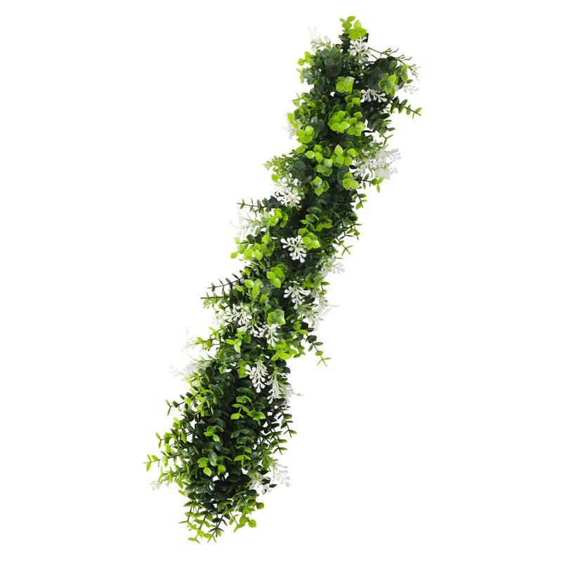 Artificial hanging vine garland with green leaves and small white blossoms, decorative plant
