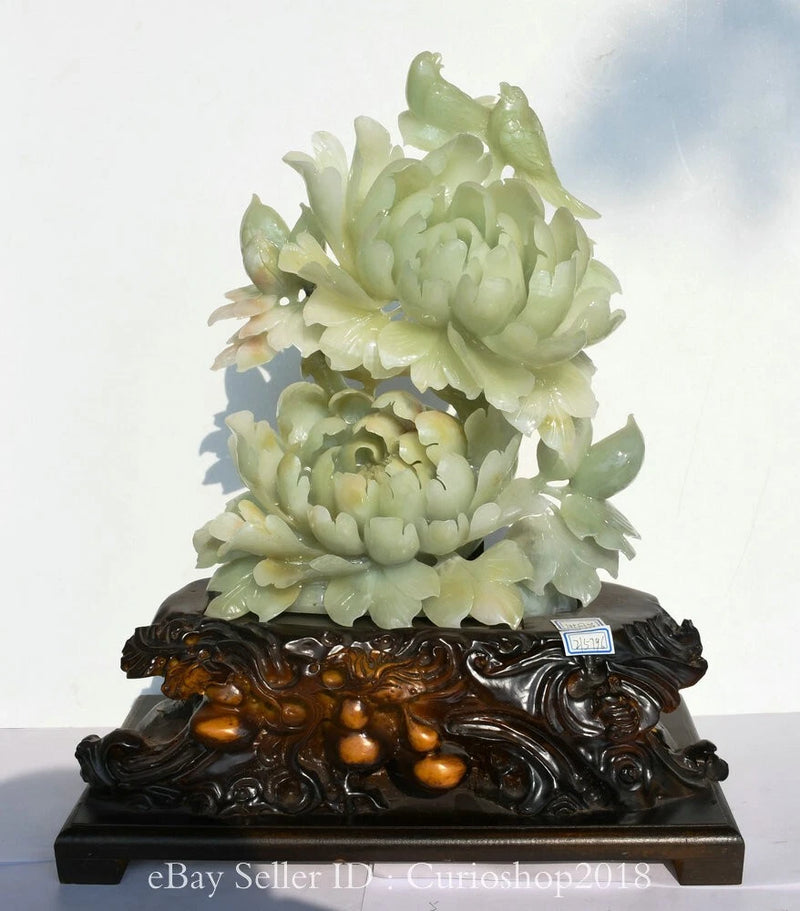 Green jade peony flower carving sculpture on dark ornate base