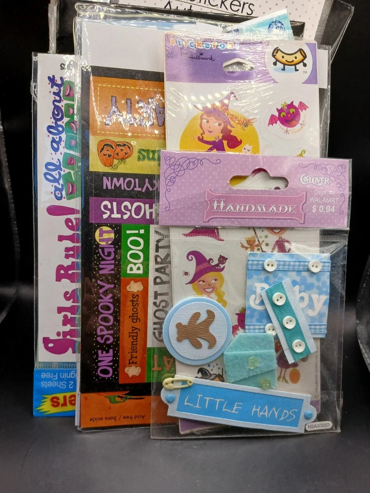 Assorted scrapbook sticker set with mixed designs, bows, animals, and letters in purple and blue