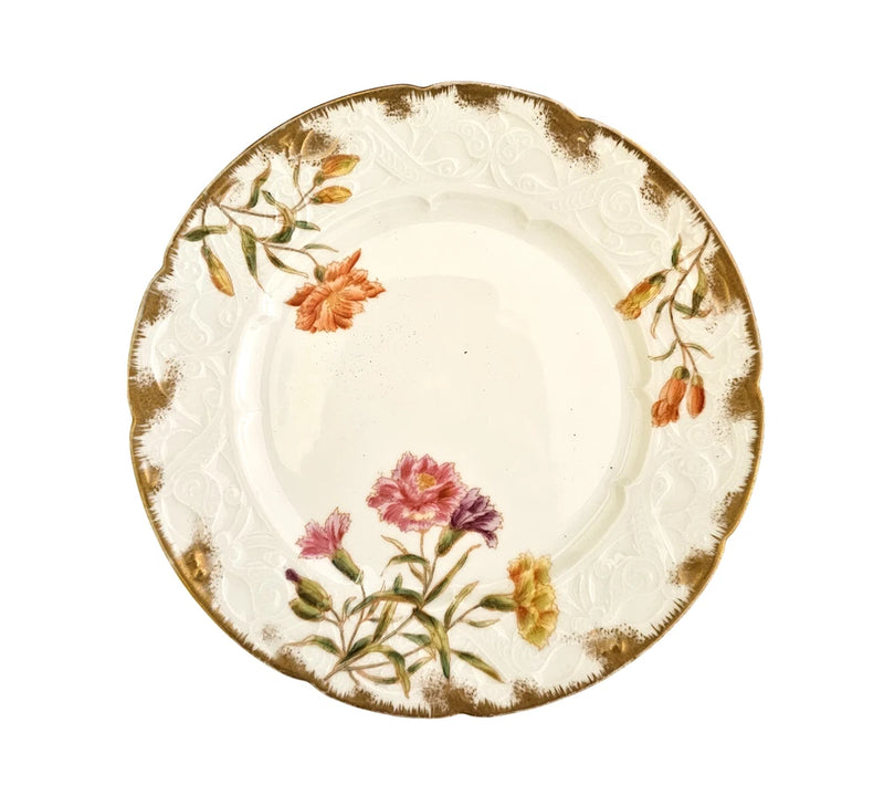Round white porcelain plate with gold rim and hand-painted pink carnation floral design