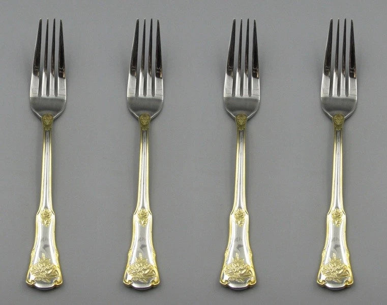 Set of four dinner forks with gold rose-pattern handles and stainless steel tines