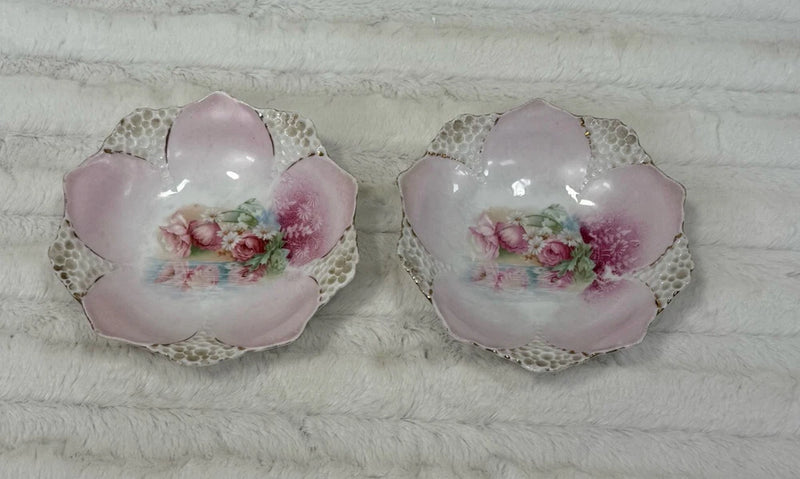Pair of pink flower-shaped berry bowls with floral centers and gold trim