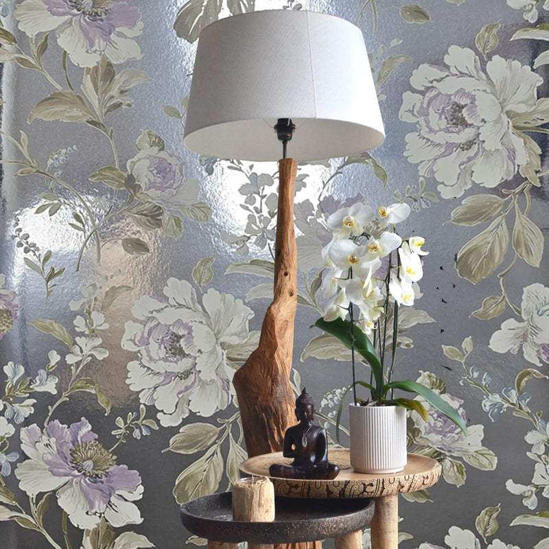Peony blossom wallpaper pattern with branches and floral blooms in soft metallic purple tones