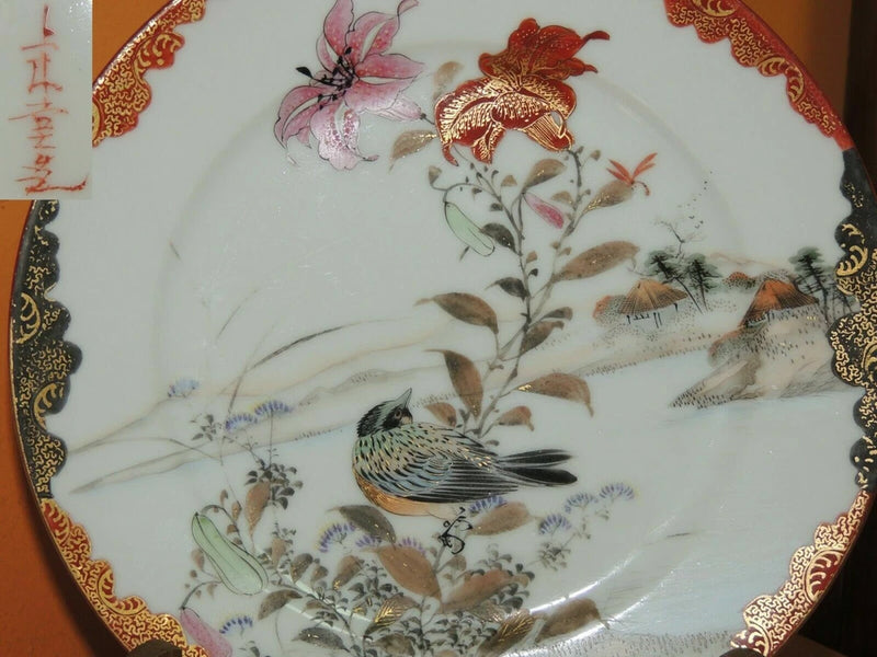 Porcelain display plate with bird, lily flowers, and gold scalloped rim