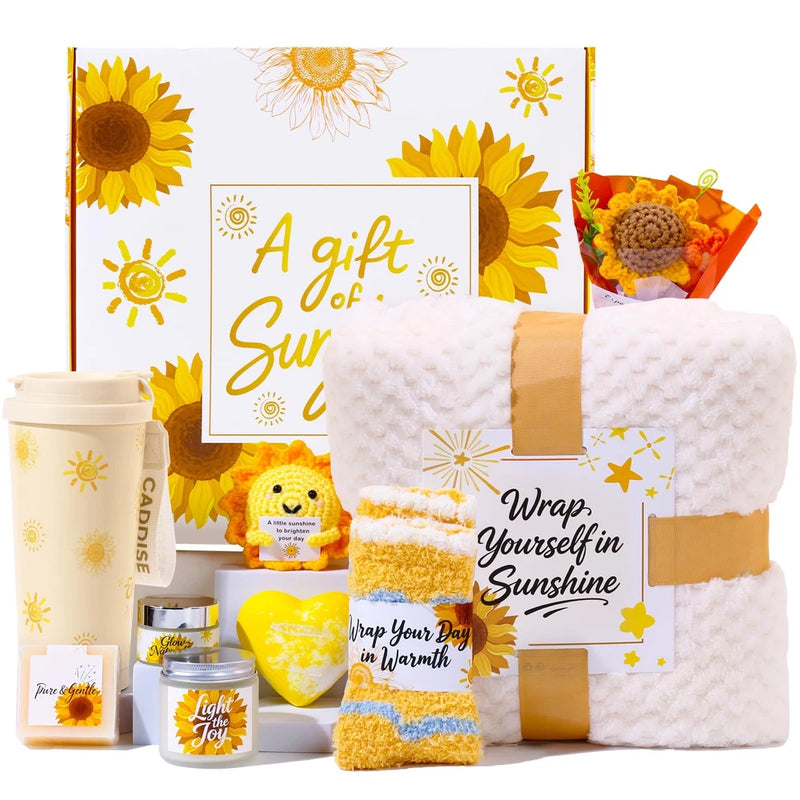Sunflower gift box set with wrapped self-care items, towel, bath sponge, and mugs