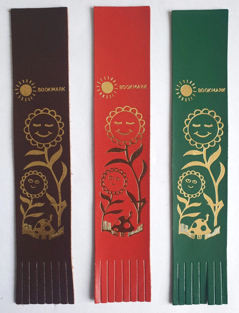 Leather bookmark trio: brown, red, and green with smiling faces and sunflowers