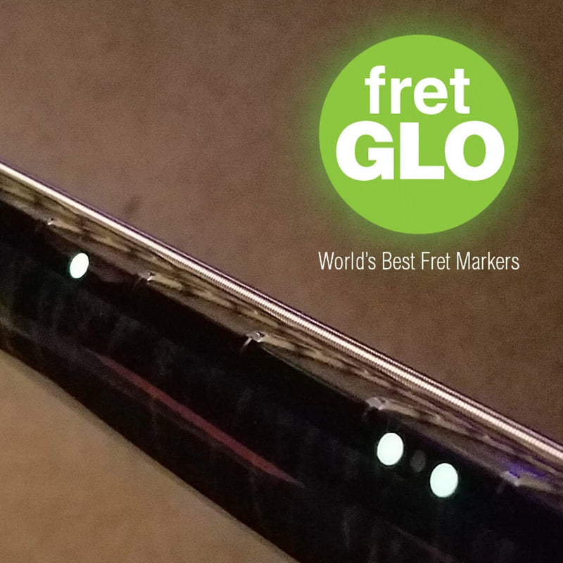 Fret position marker set for guitar or bass, glowing white dot markers on neck