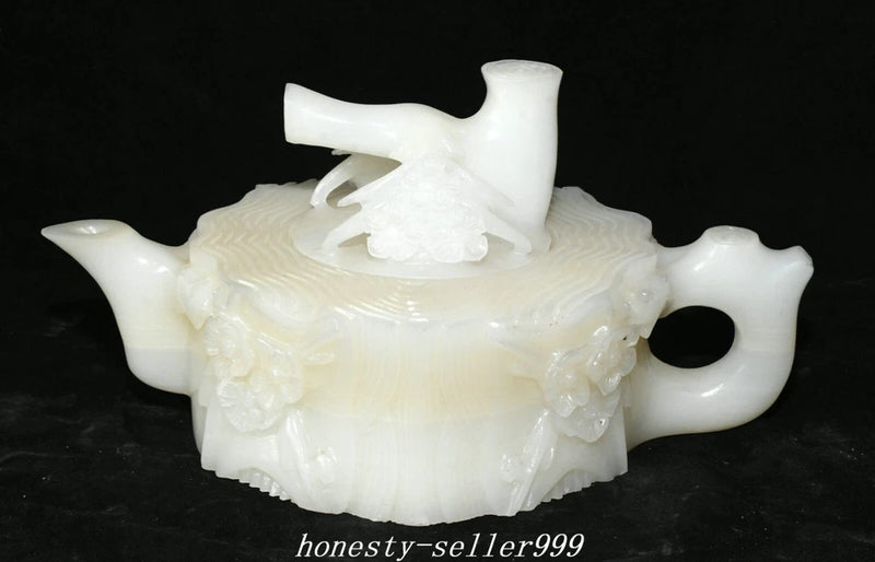 Carved white peony teapot with spout, handle, and knob lid