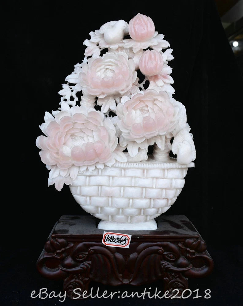 Carved peony flower basket statue with pink and white blossoms