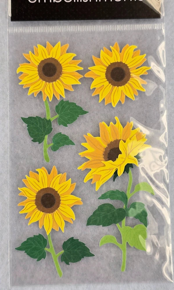 Sunflower dimensional flower stickers set on a clear backing, with four sunflower designs