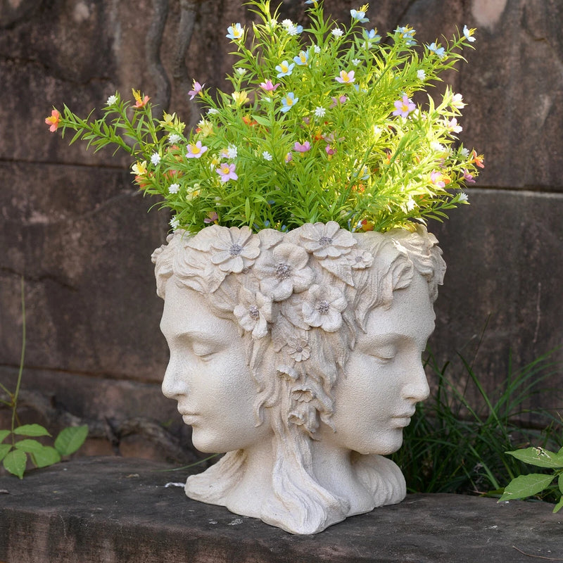 Stone-look woman head sculpture planter with flowers