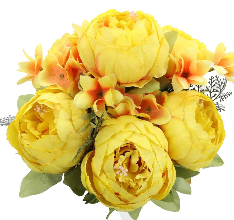 Artificial yellow peony silk flowers bouquet with layered petals and green leaves