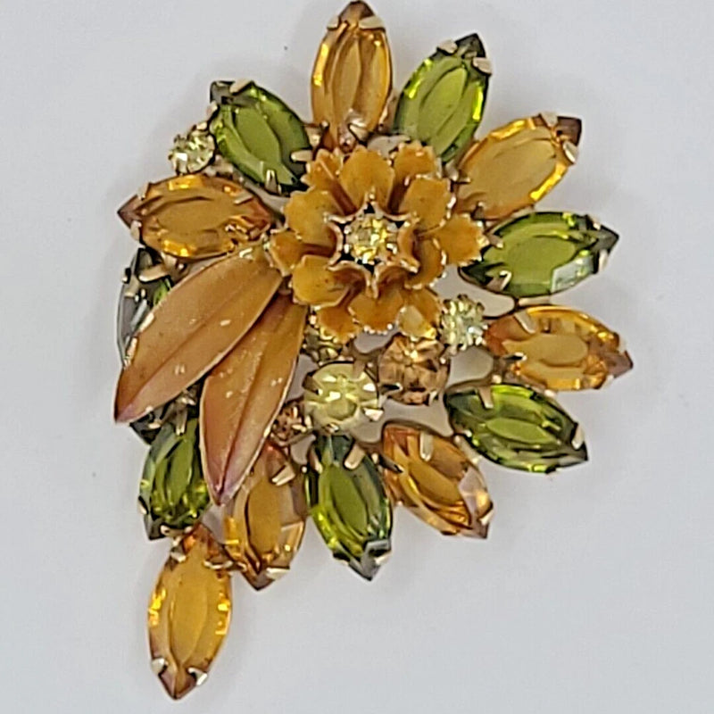 Carnation flower brooch with amber and green rhinestones and enamel petals