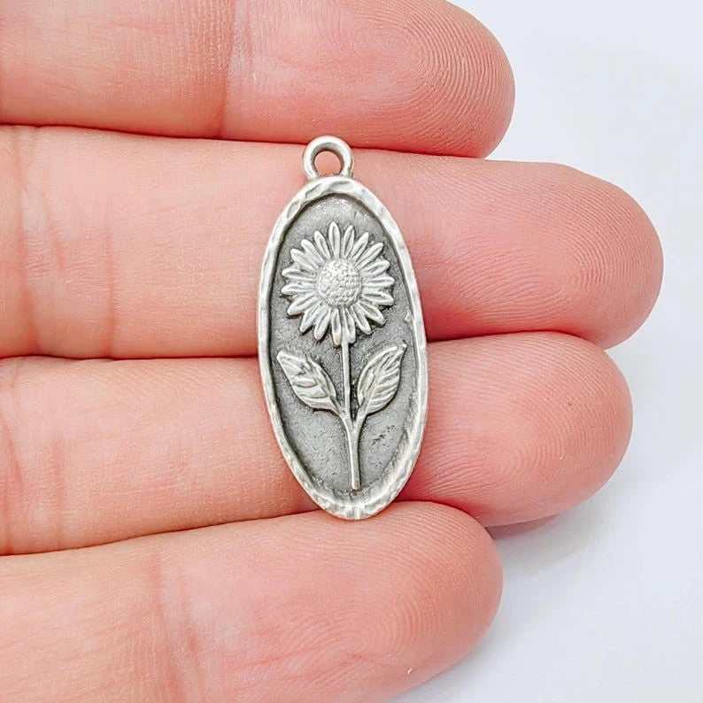 Sunflower oval mini pendant charm with loop, silver-tone metal and raised flower detail