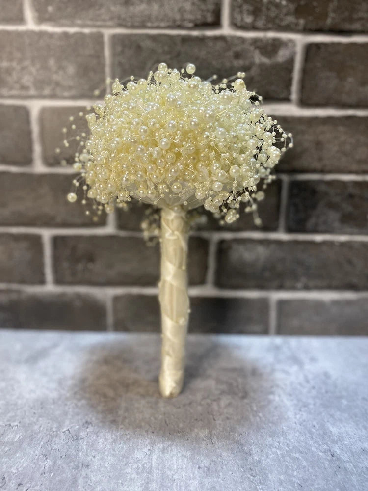 Pearl bouquet with cascading bead clusters and wrapped handle