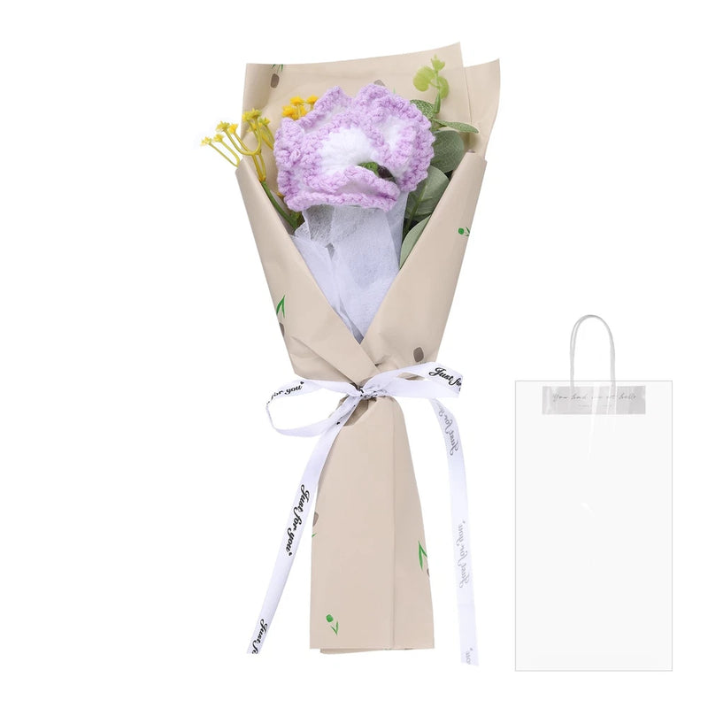 Handmade knitted bouquet with purple crochet carnations wrapped in kraft paper