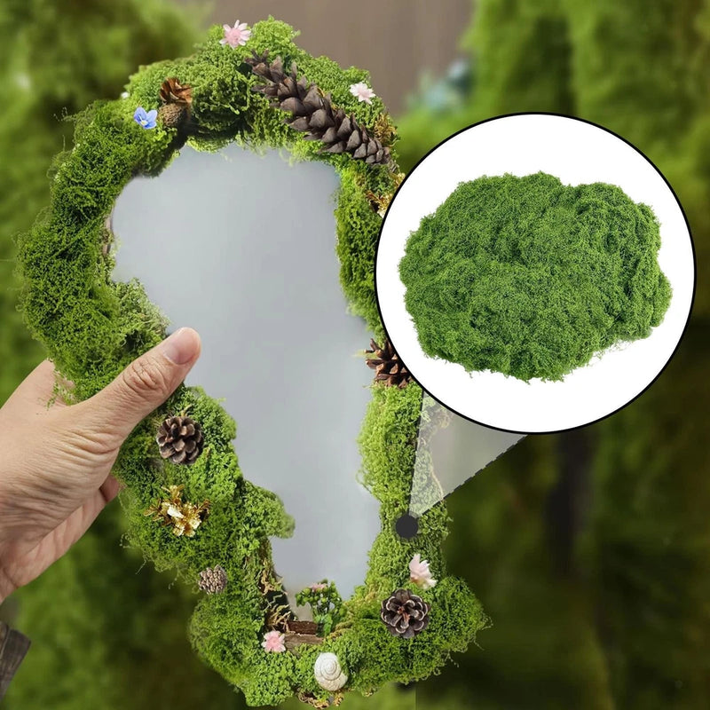 Artificial faux moss wreath with green moss, small flowers and pinecone-like accents