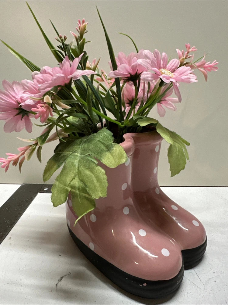 Pink ceramic rain boot decor with white polka dots and black sole