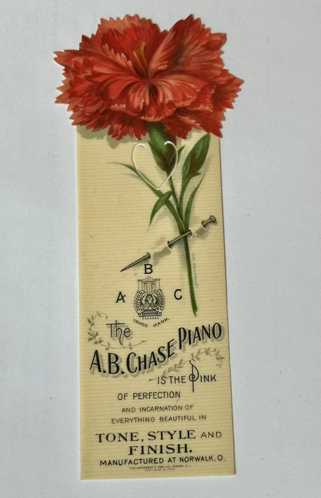 Vintage piano music advertising bookmark with red carnation flower and printed title text