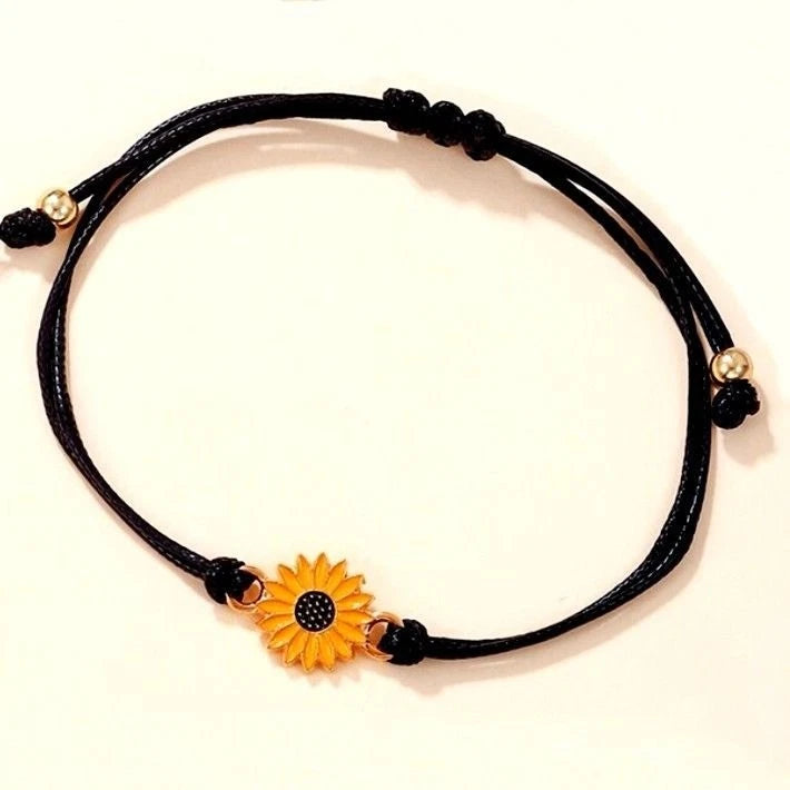 Black double leather strand bracelet with sunflower charm and gold bead accents
