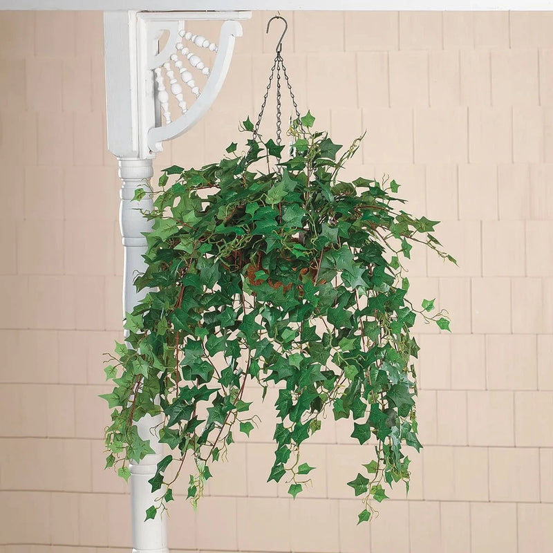 Artificial ivy hanging basket with trailing green leaves on chain hooks