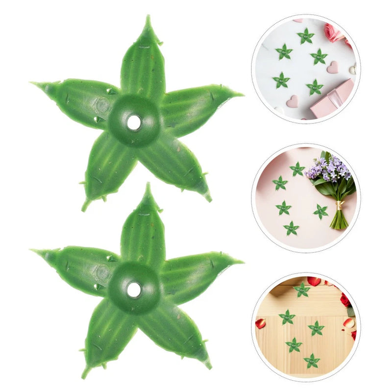 Artificial carnation flower parts: two green faux blooms with leaf-like petals and center holes
