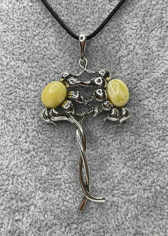 Sterling silver sunflower pendant with two round yellow amber stones on a vine-like frame