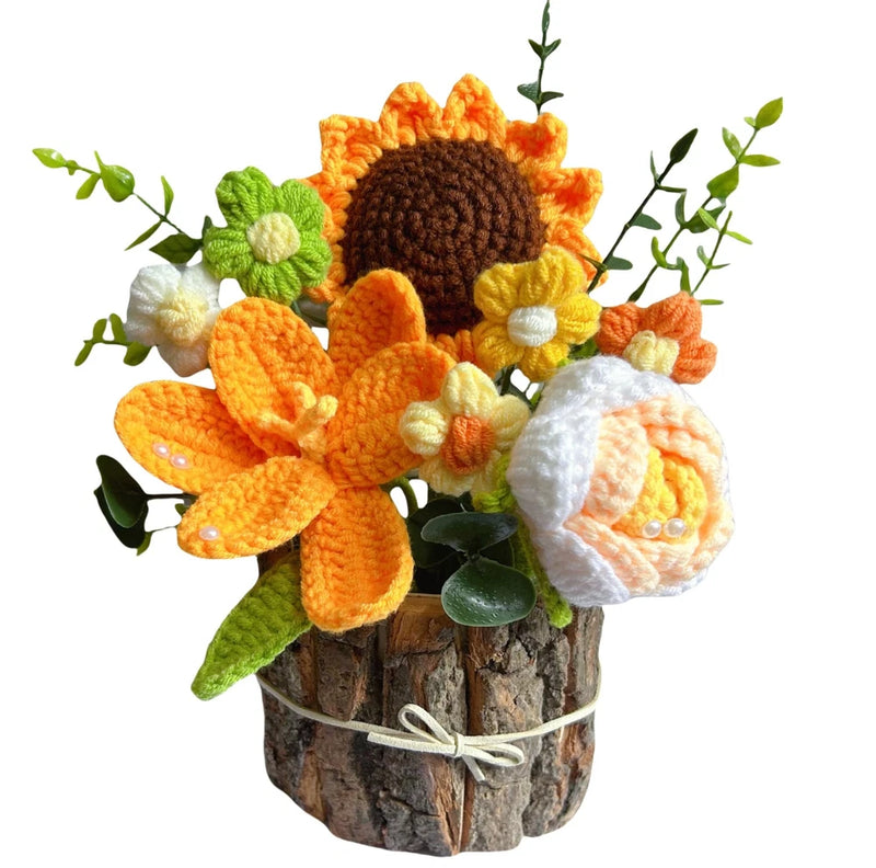Crocheted floral arrangement in rustic wooden stump pot with orange, yellow, white flowers and leaves