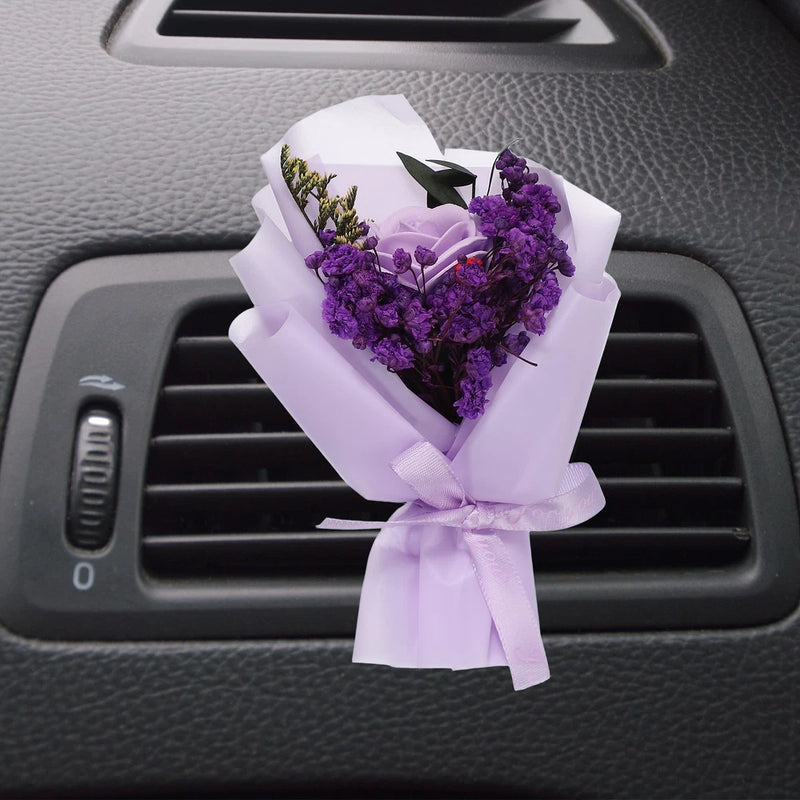Car vent clip dried flower bouquet with light purple blossoms and white ribbon