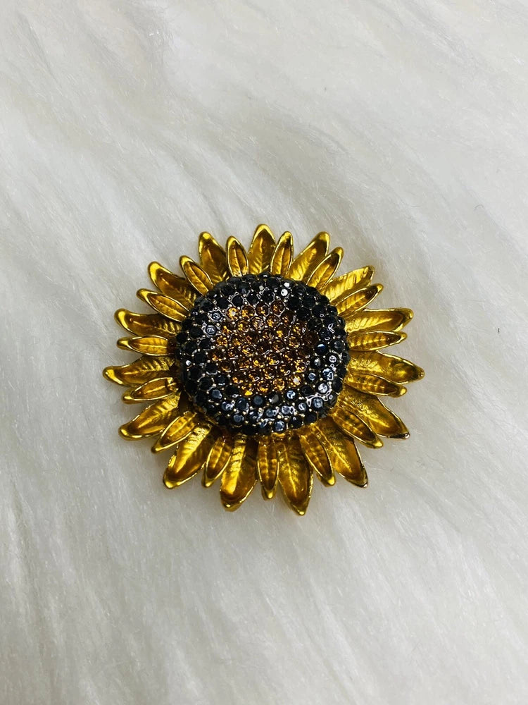 Gold-tone sunflower rhinestone brooch pin with black glitter center