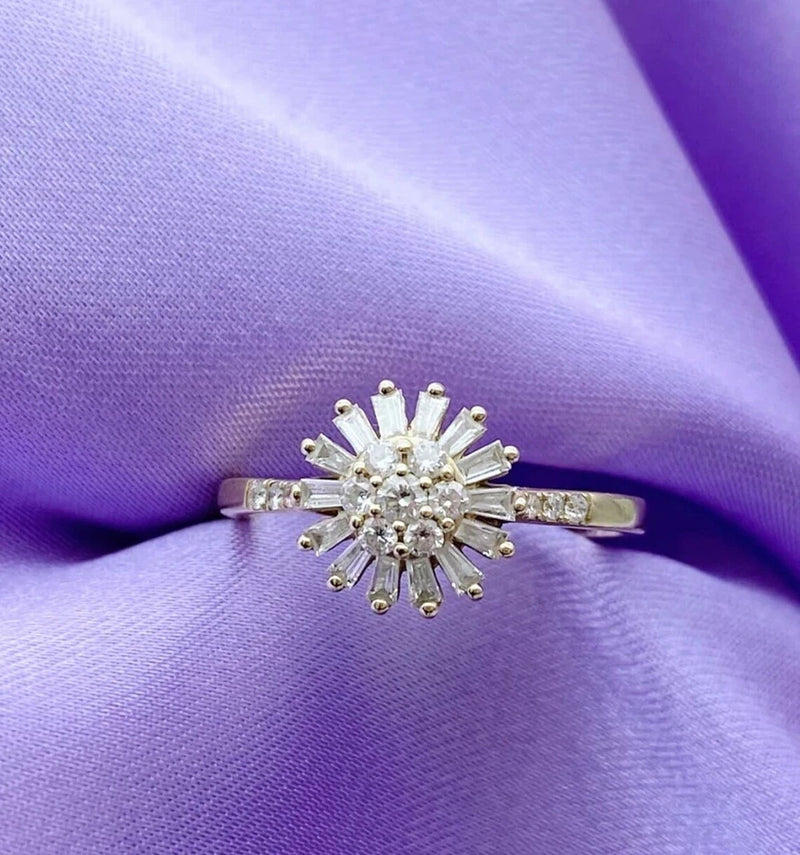 Sterling silver sunflower-shaped ring with round center and baguette-cut stones
