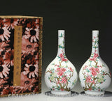 Porcelain bottle vase pair with pastel peony and floral branch designs