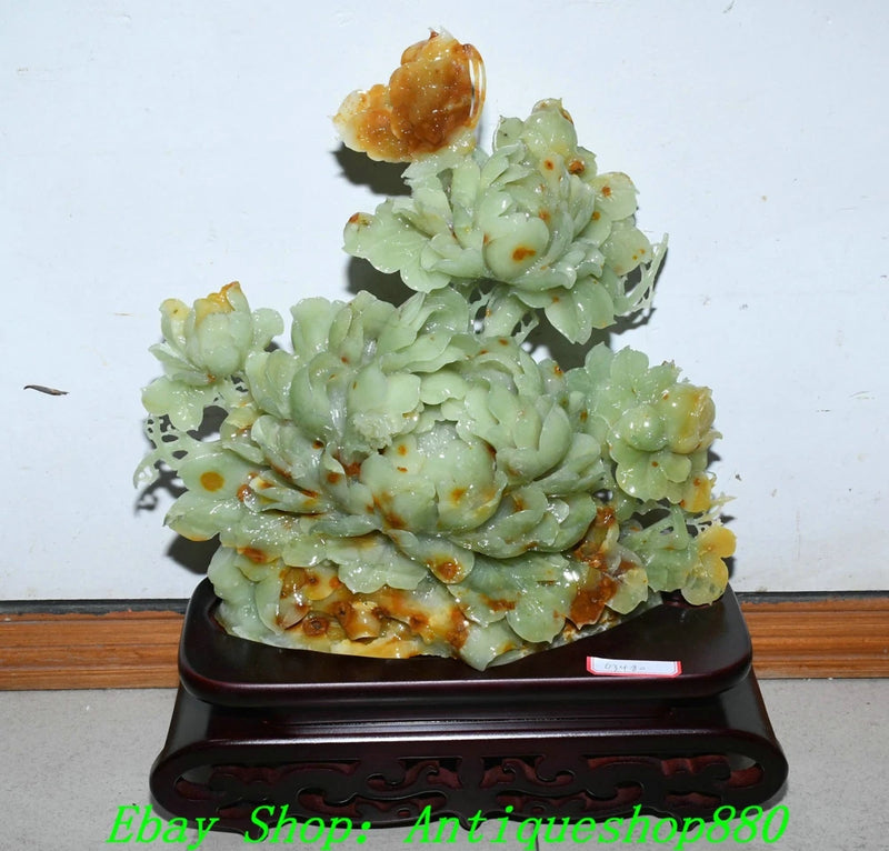 Jade peony flower carving sculpture with light green blossoms on dark base