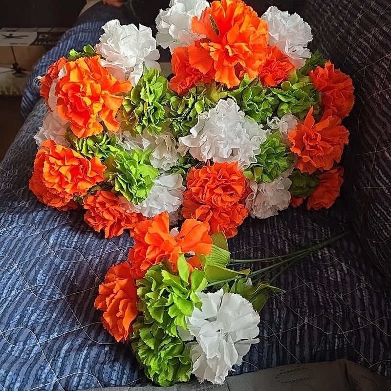 Artificial carnation flower bouquet with orange, white, and green blooms