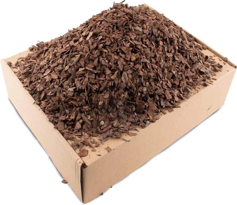 Organic orchid potting bark, natural mulch in carton box with dark brown bark pieces